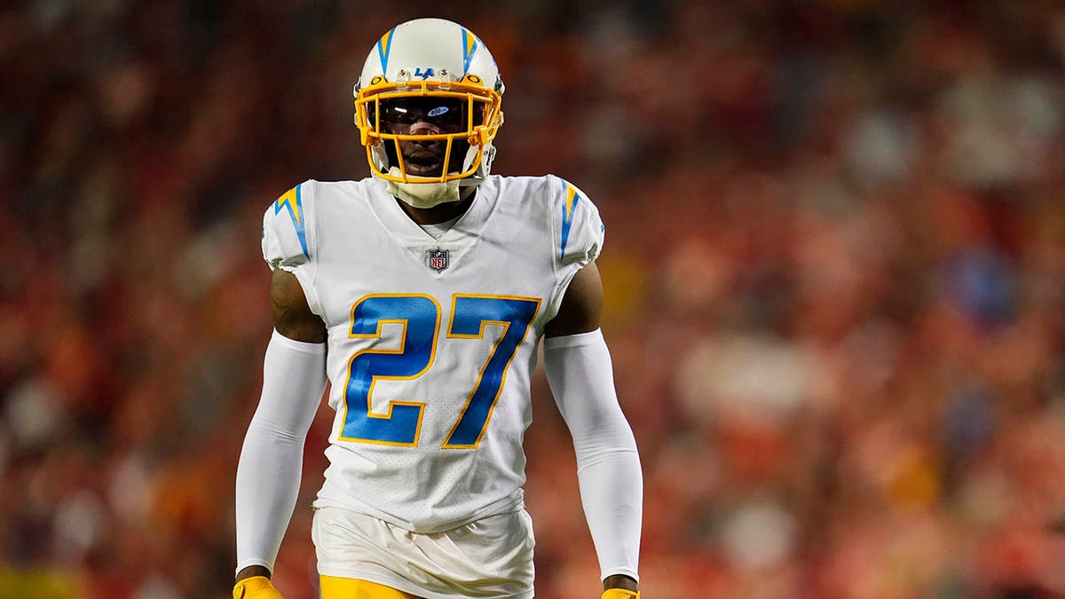 J.C. Jackson stands on the field during a game against the Chiefs