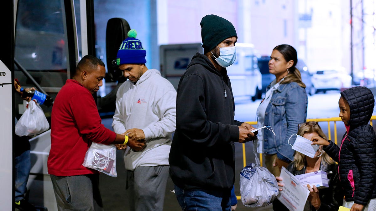 Migrants disembark bus in NYC