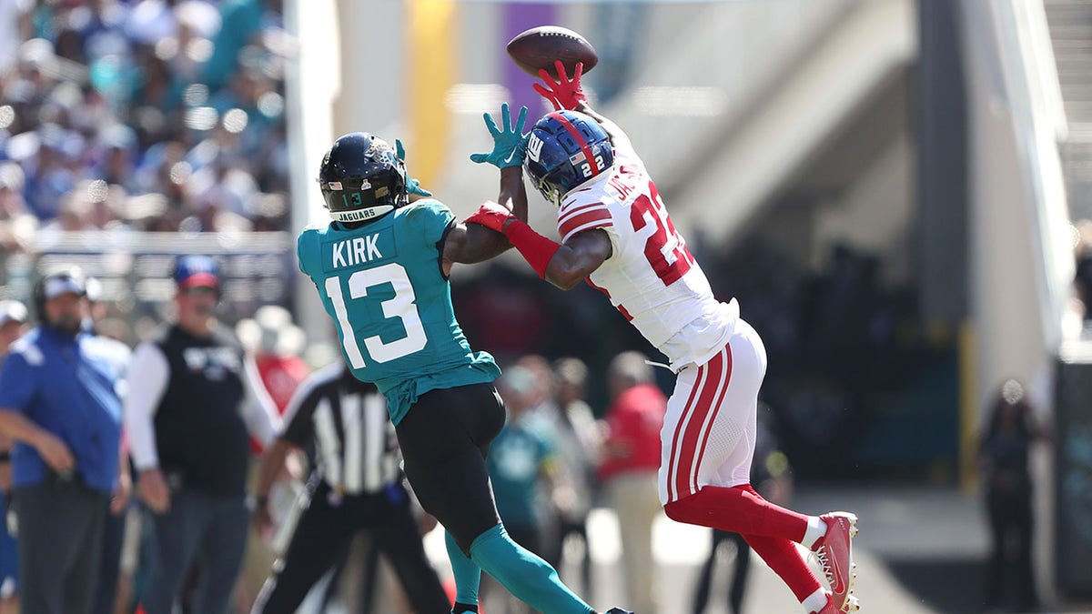 Adoree' Jackson bats down a pass intended for a jaguars player