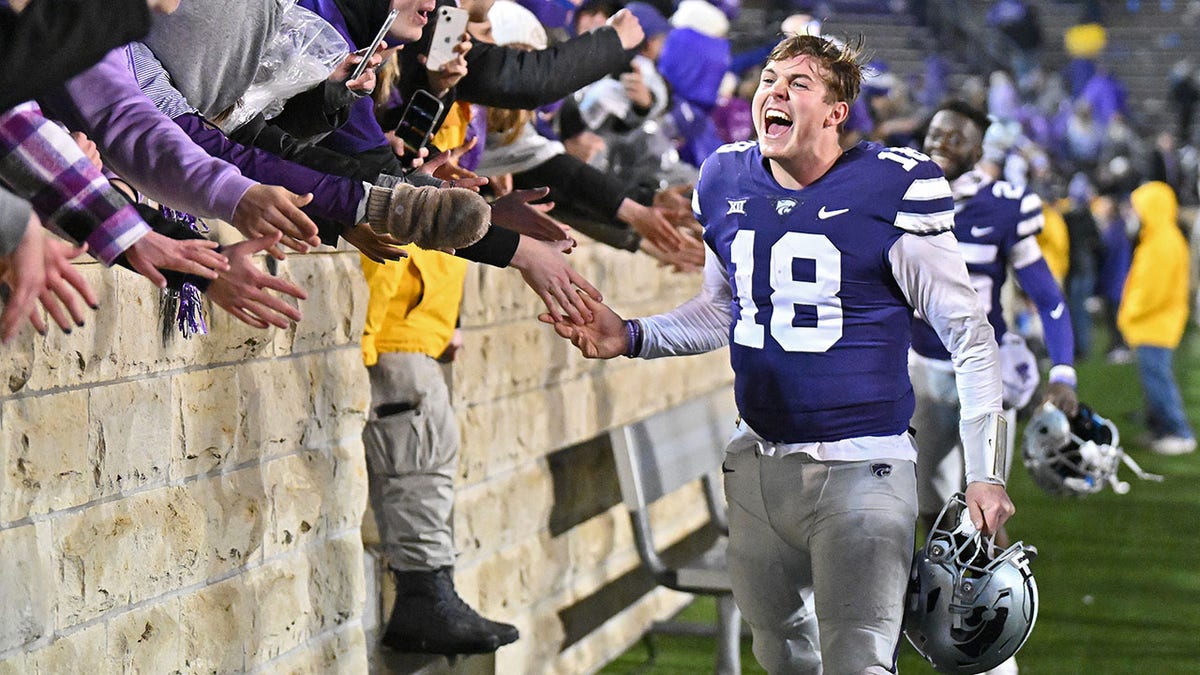 Will Howard celebrates after beating Kansas