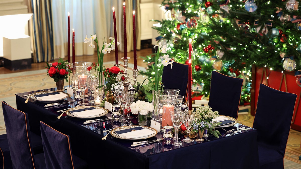 A photo of the table, showing plates and the decorative arrangement