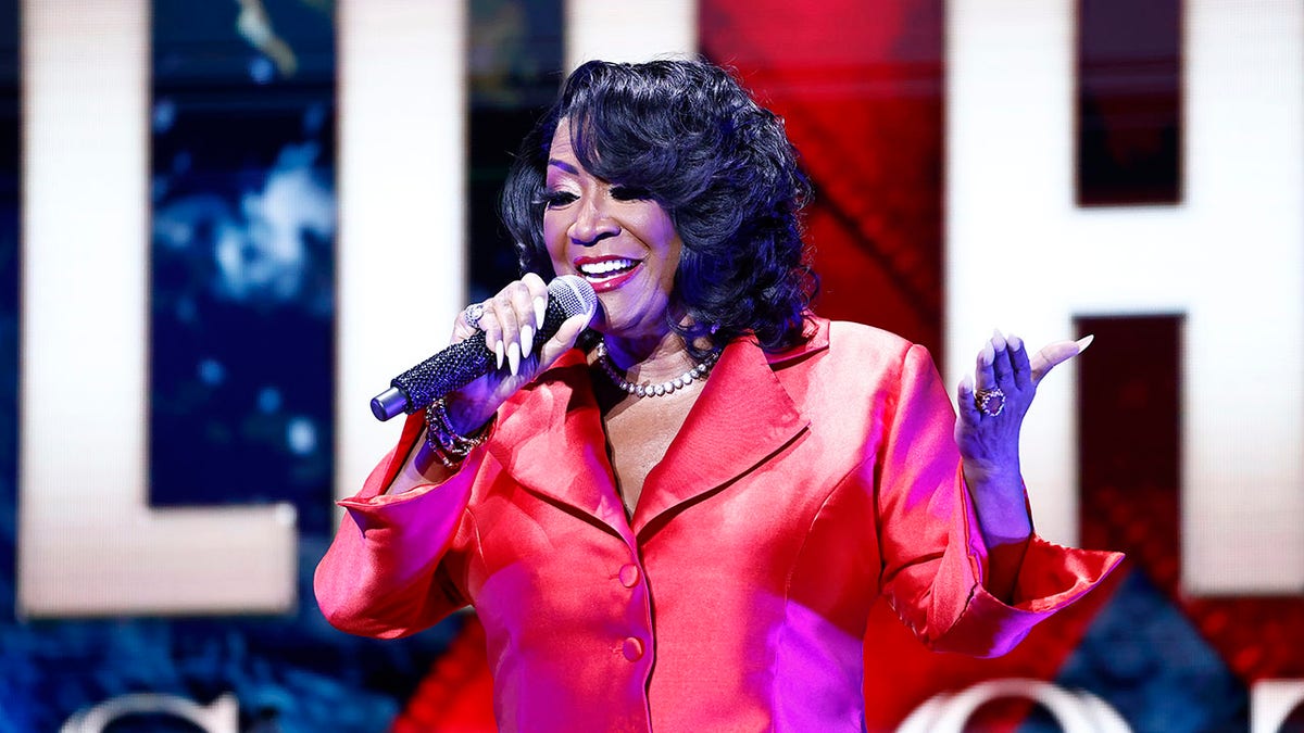Patti LaBelle sings into microphone