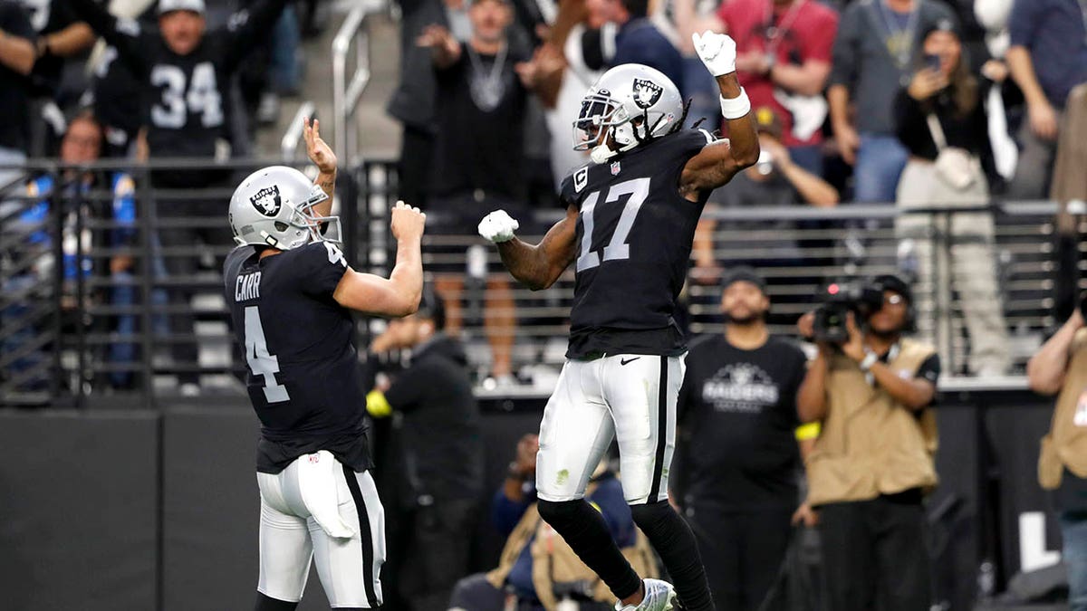 Davante Adams celebrates a touchdown with Derek Carr