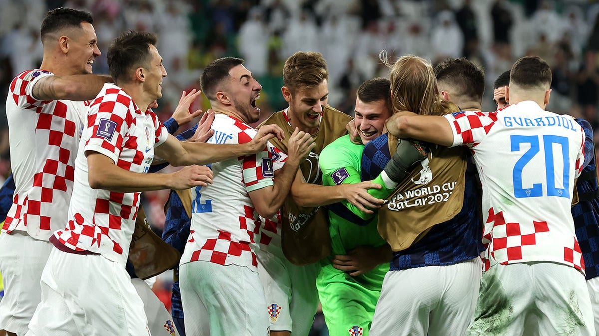 Croatia players celebrate beating Brazil in penalty kicks