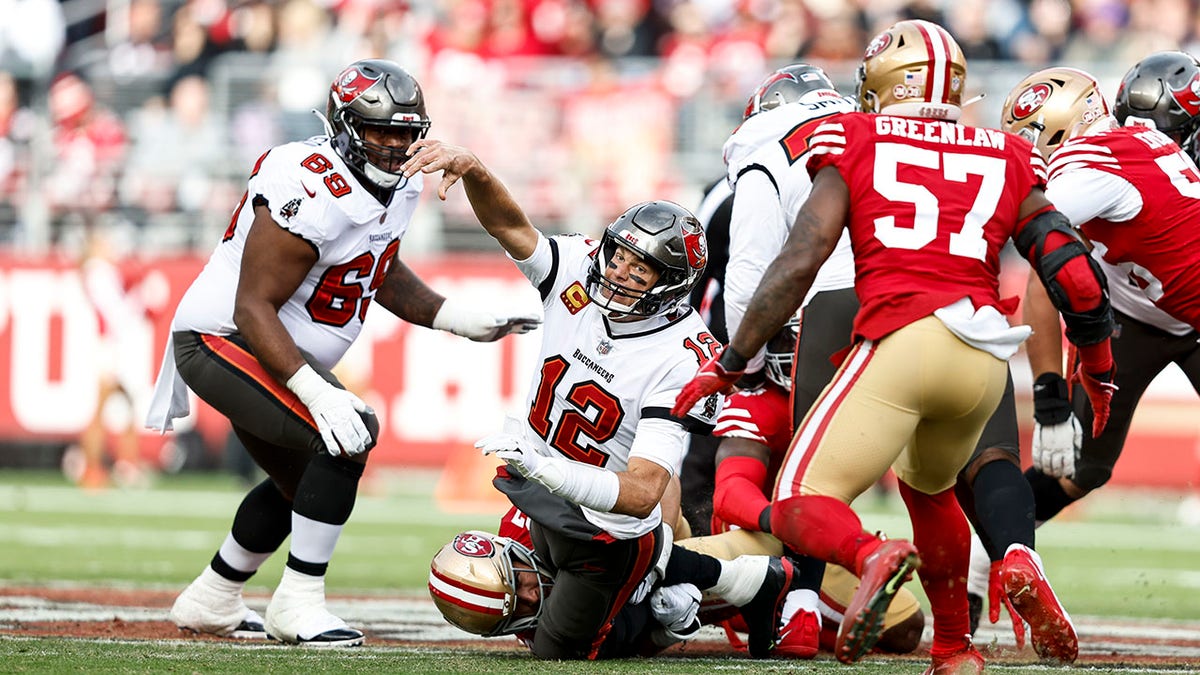 Tom Brady gets tackled by Nick Bosa