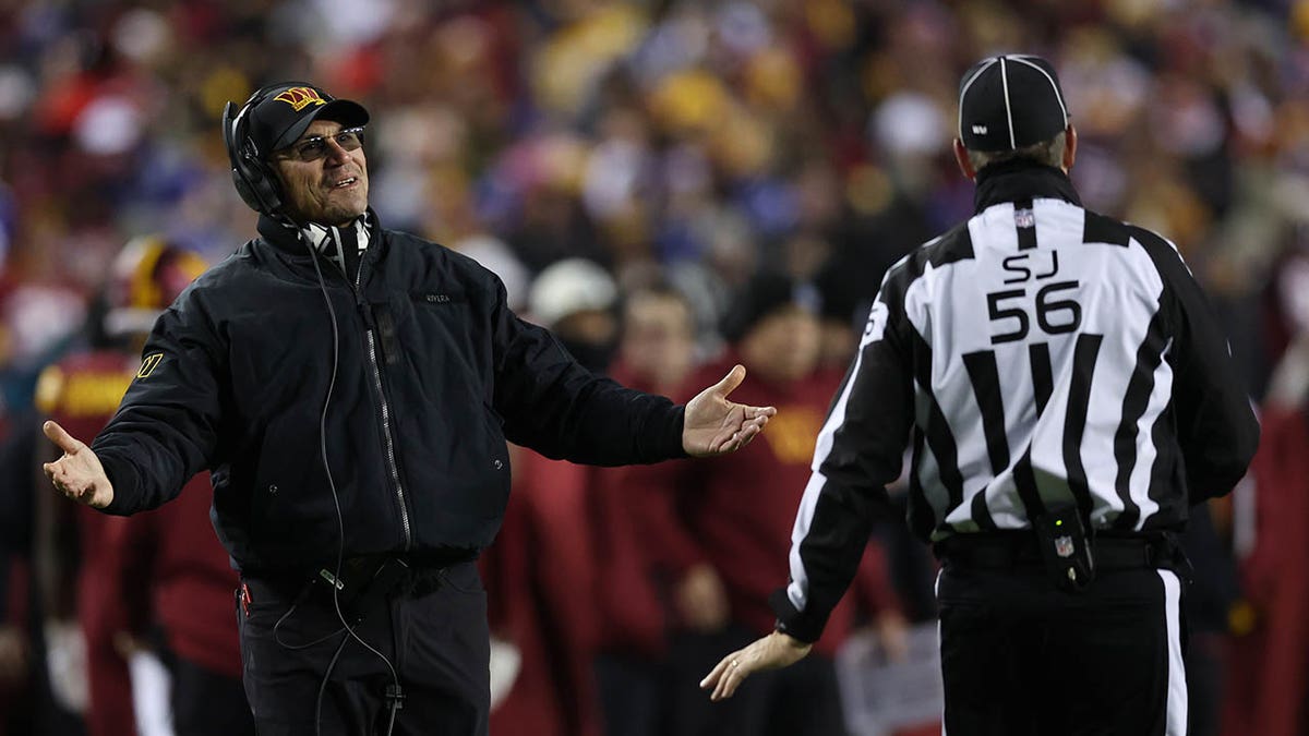 Ron Rivera argues with an NFL Official