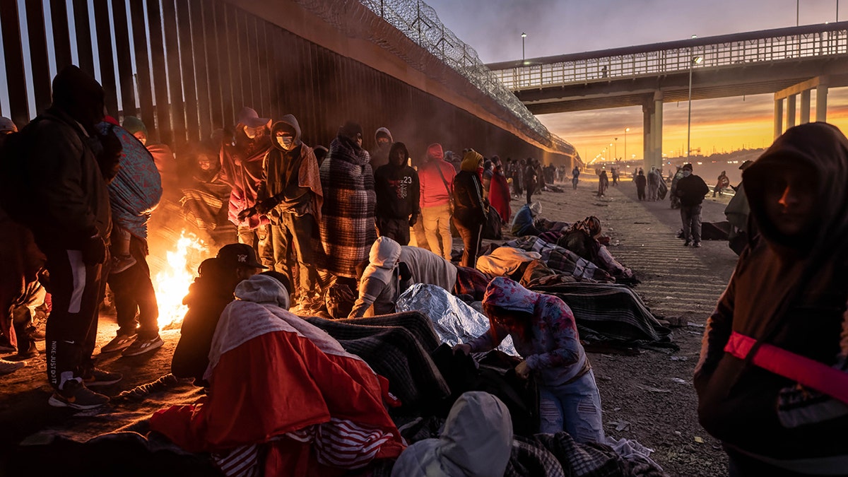 Migrants by a fire