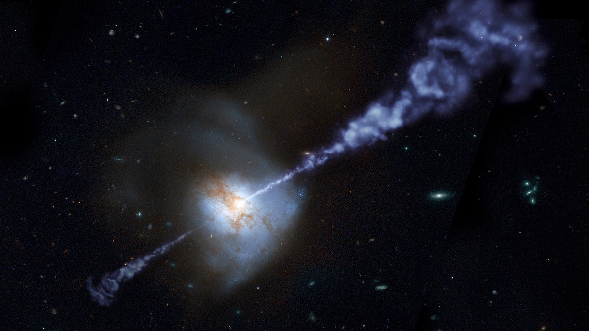 A distant photo of a galaxy with dust and smoke forming a line