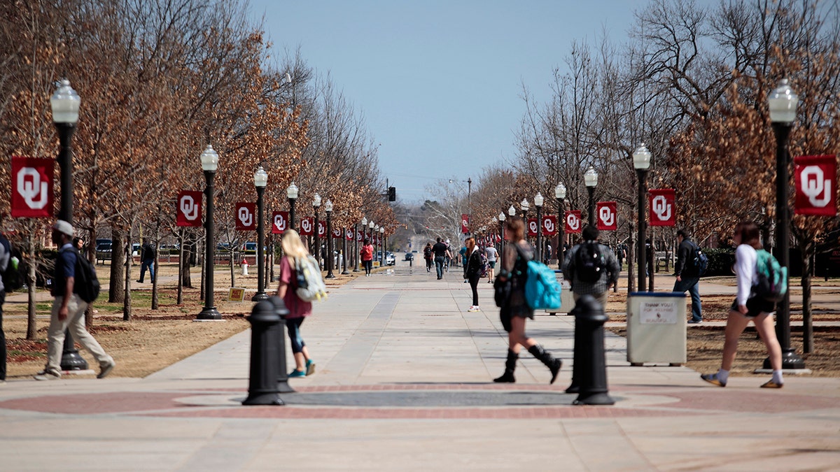 University of Oklahoma students walking on campus 