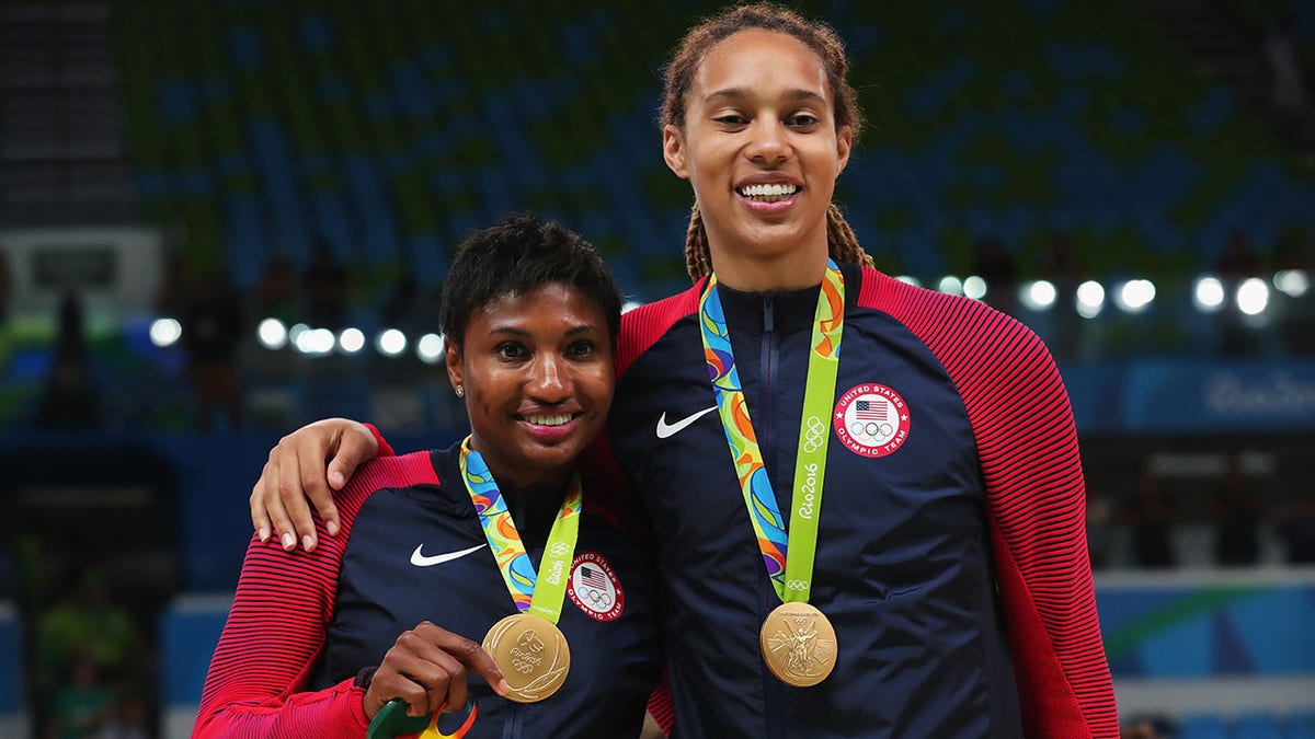 Brittney Griner and Angel McCoughtry pose with their Olympic gold medals