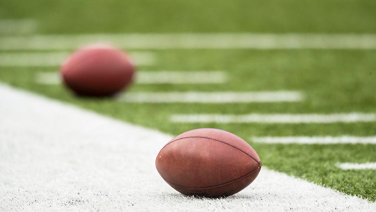 Generic view of American footballs on a field