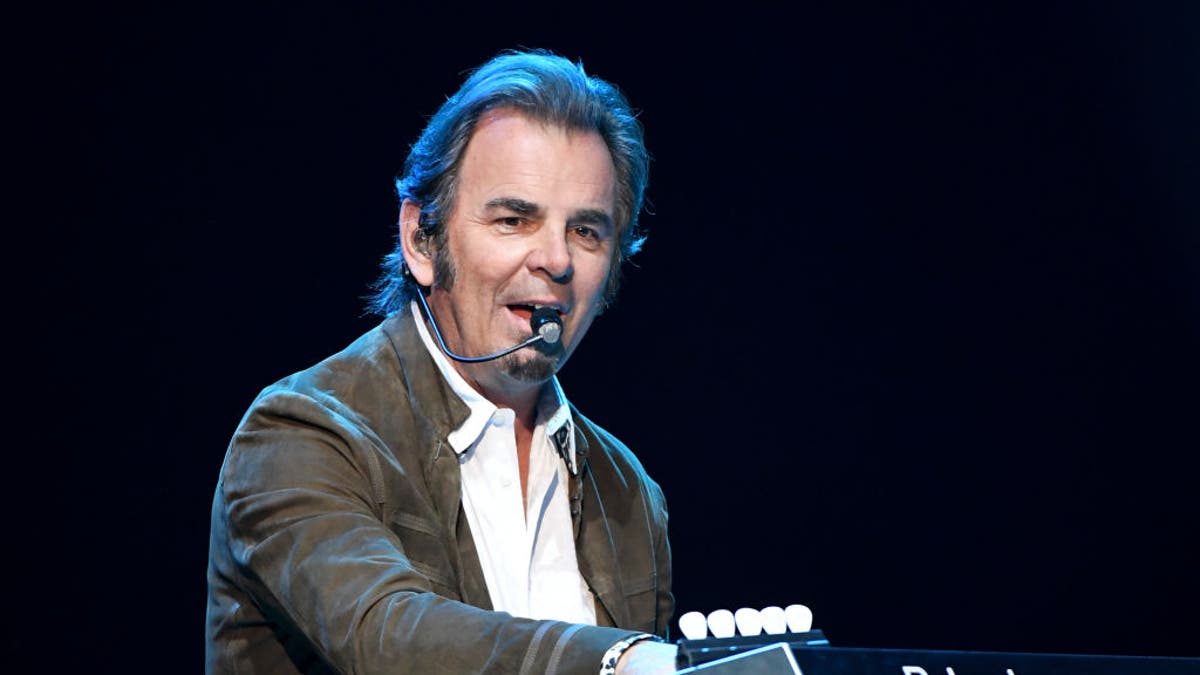 Journey's Jonathan Cain plays the keyboard