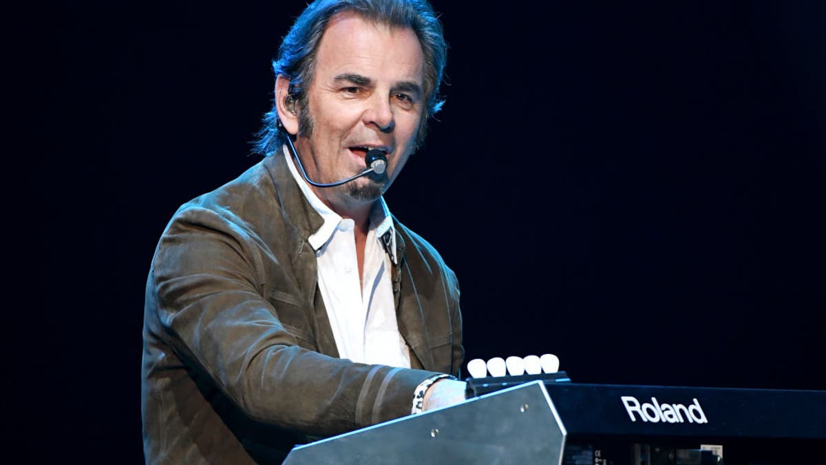 Journey's Jonathan Cain plays the keyboard