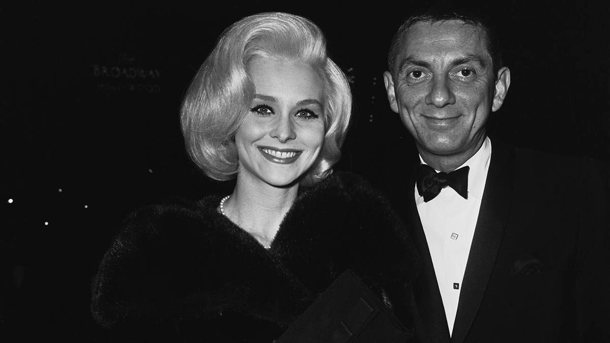 Diane McBain smiling with Aaron Spelling