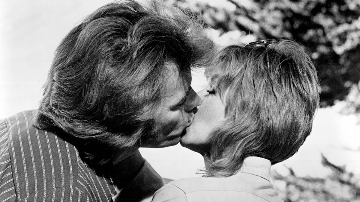 Clint Eastwood and Donna Mills kissing