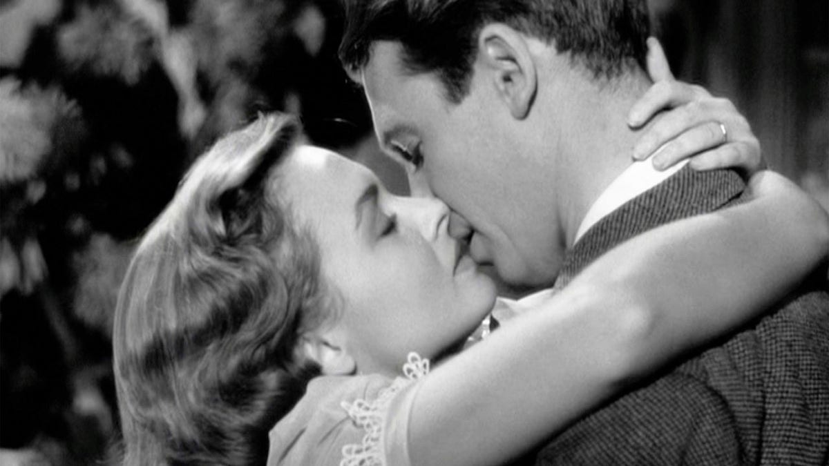 Donna Reed kissing Jimmy Stewart