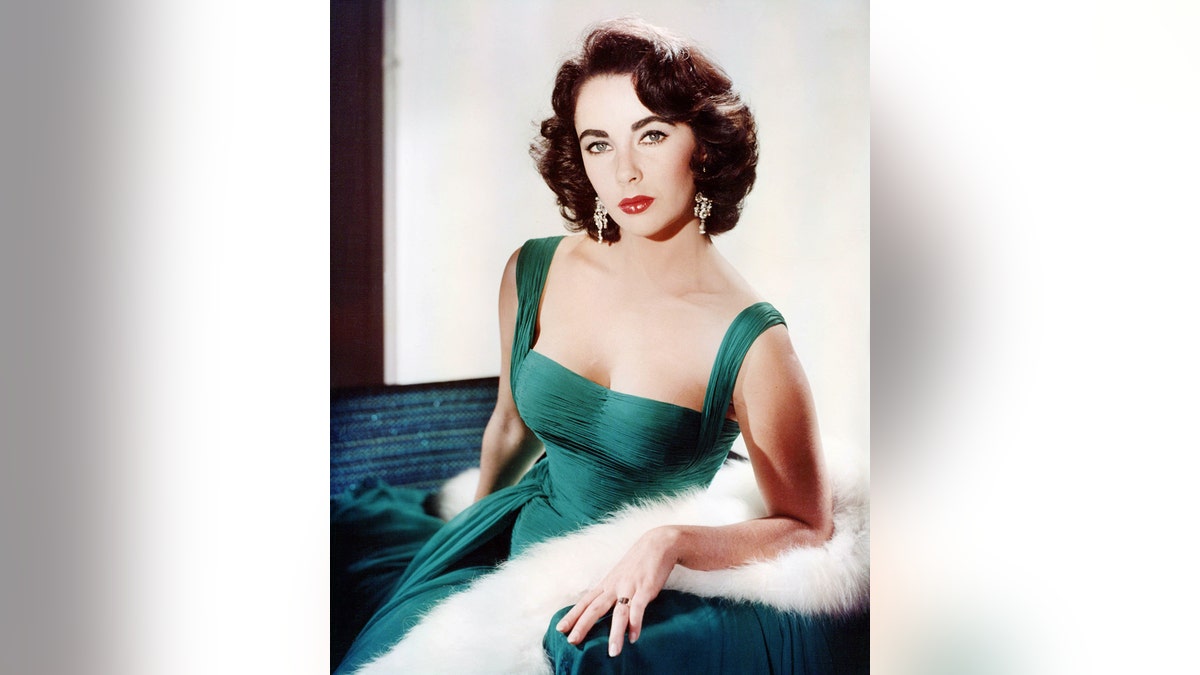 Elizabeth Taylor wearing a green dress when she was young