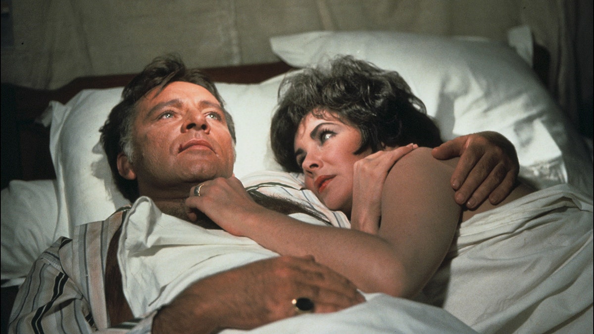 Elizabeth Taylor and Richard Burton in bed together