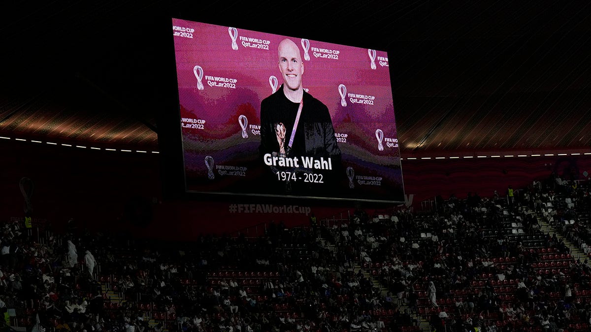 Photo of journalist Grant Wahl on a stadium big screen