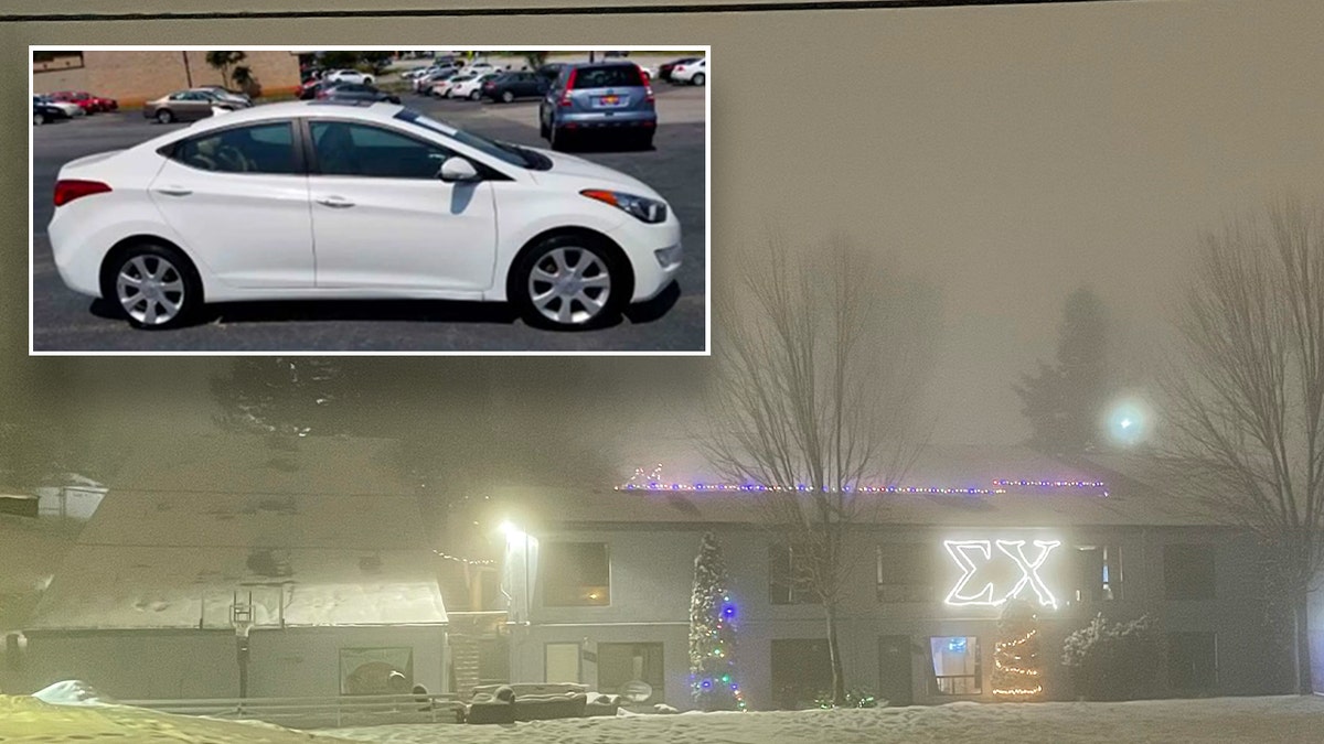 Sigma Chi house lit up through fog at night