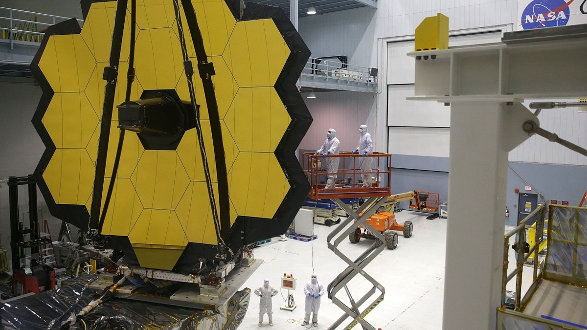 Engineers and technicians assemble the James Webb Space Telescope