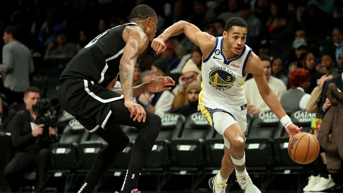 Jordan Poole of the Golden State Warriors drives to the basket