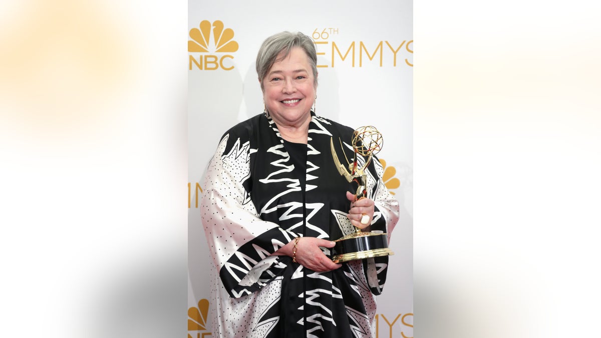Kathy Bates holding her Emmy after winning for "American Horror Story: Coven" in 2014.