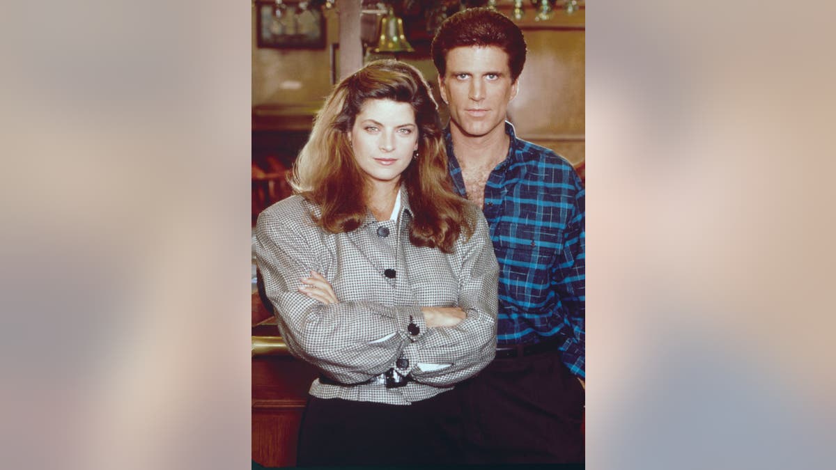Kirstie Alley and Ted Danson pose for Cheers photos