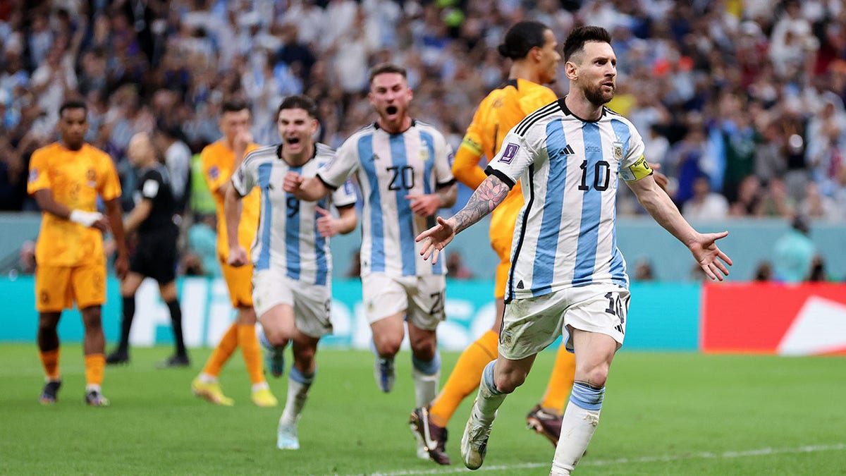 Lionel Messi and Argentina celebrate after defeating the Netherlands at the  2022 FIFA World Cup 