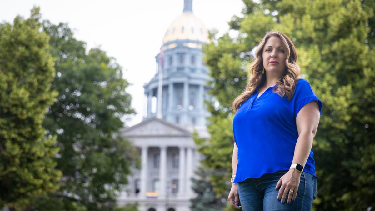 303 Creative owner Lorie Smith stands in front of the Colorado State Capitol.