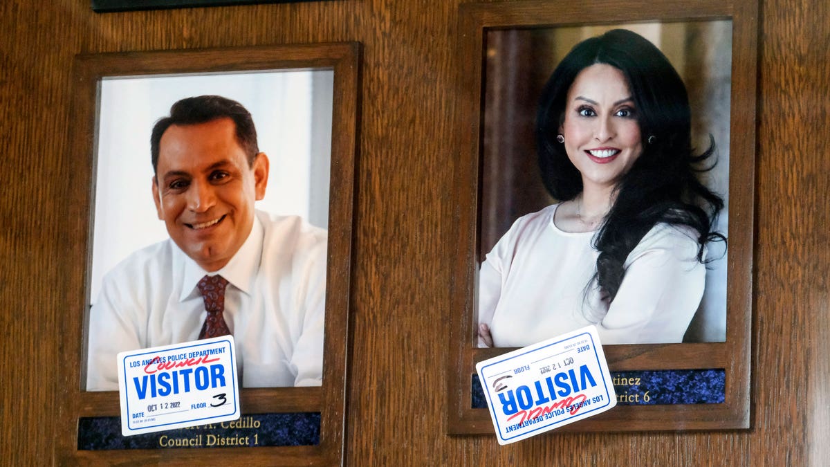 Framed pictures of LA council members Cedillo and Martinez, respectively.