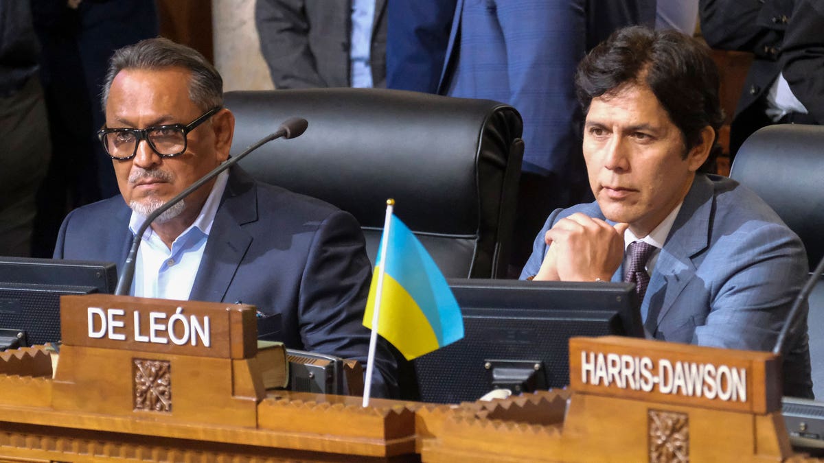 Councilmen Cedillo, and de Leon sitting at their chambers.