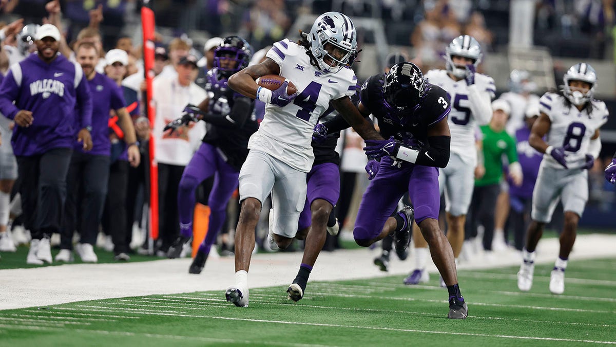 Kansas State Wildcats wide receiver is tackled
