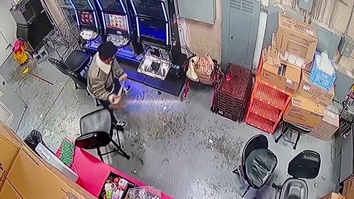 suspect smashing machine with ax