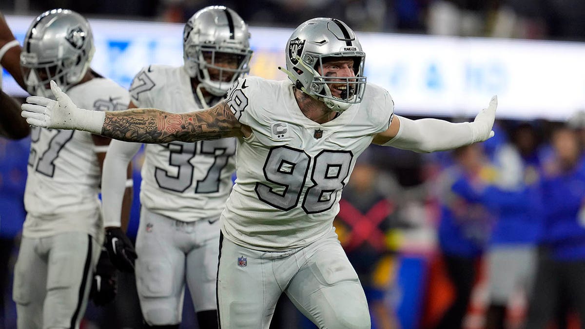 Maxx Crosby celebrates a sack