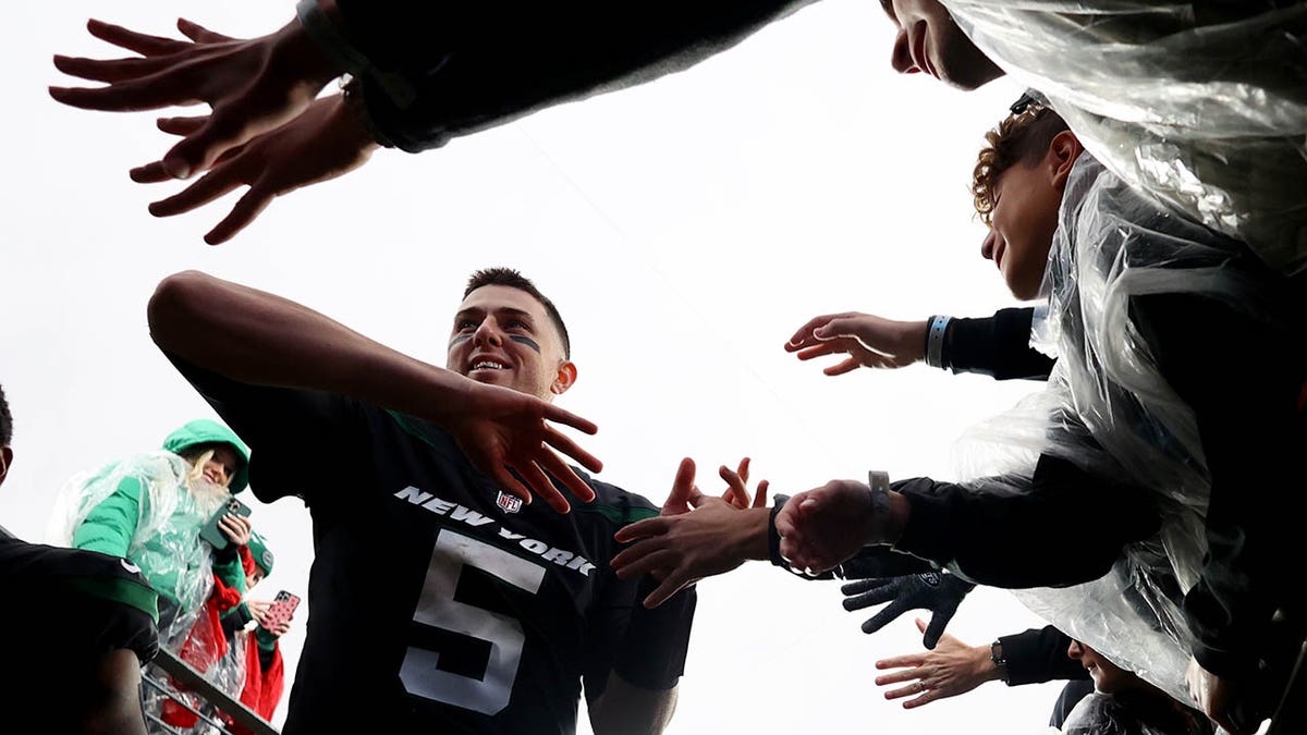 Mike White shakes hands with fans