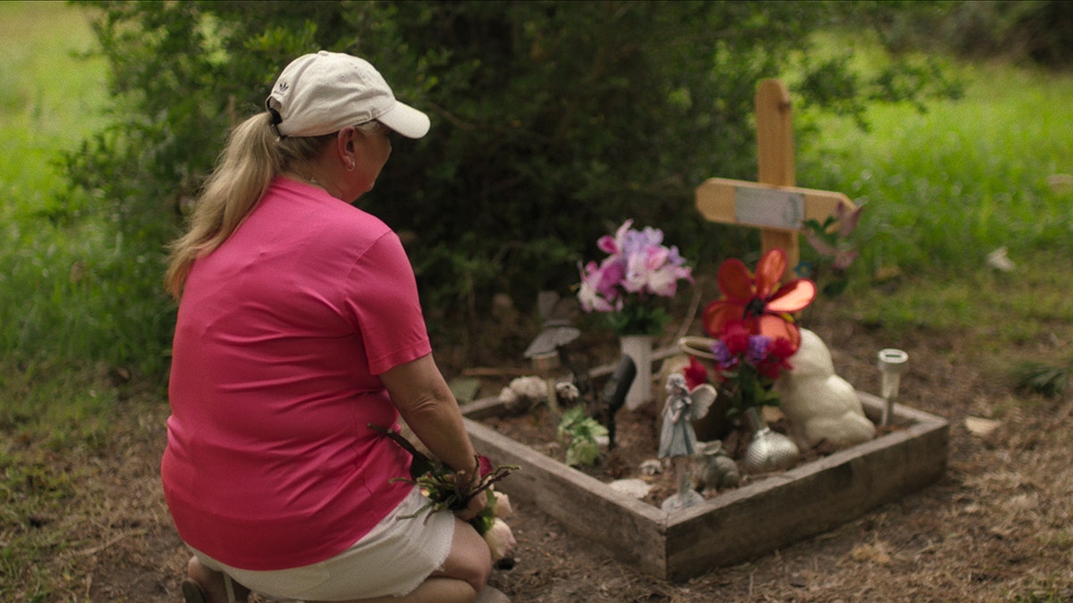 Loved ones visiting a memorial in the Texas Killing fields