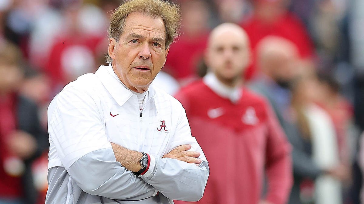 Nick Saban looks at the field