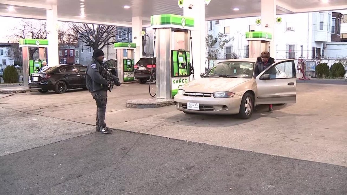 Armed guard outside gas station in North Philadelphia