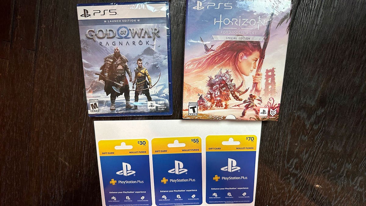 Photo of PlayStation games and gift cards.