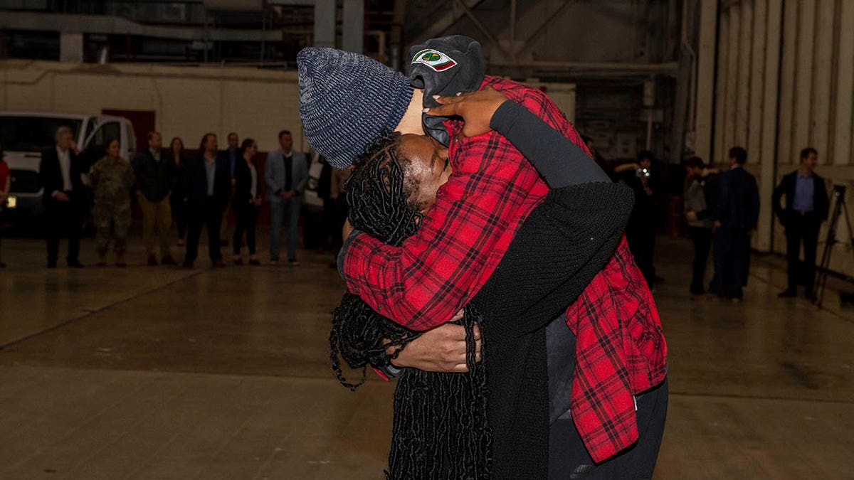 Brittney Griner hugs her wife after returning to the U.S.