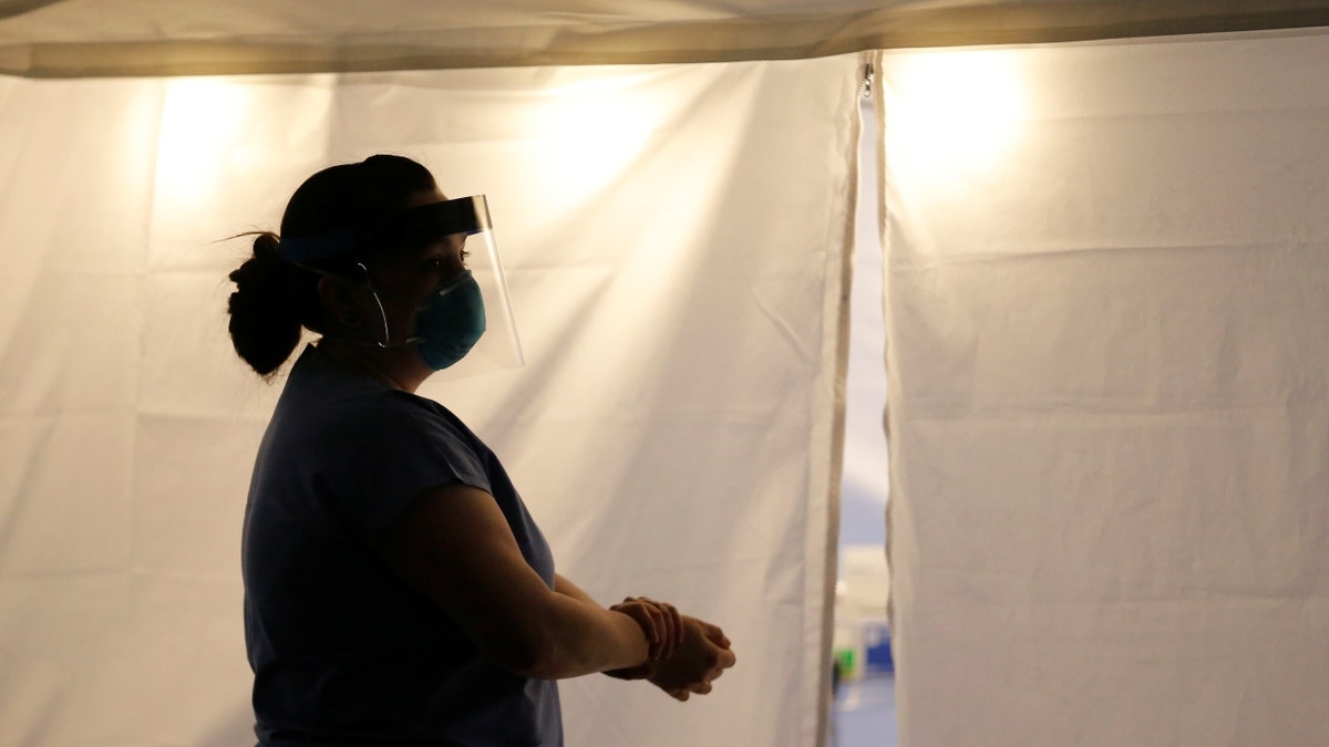 A nurse at a testing clinic for respiratory viruses in Seattle