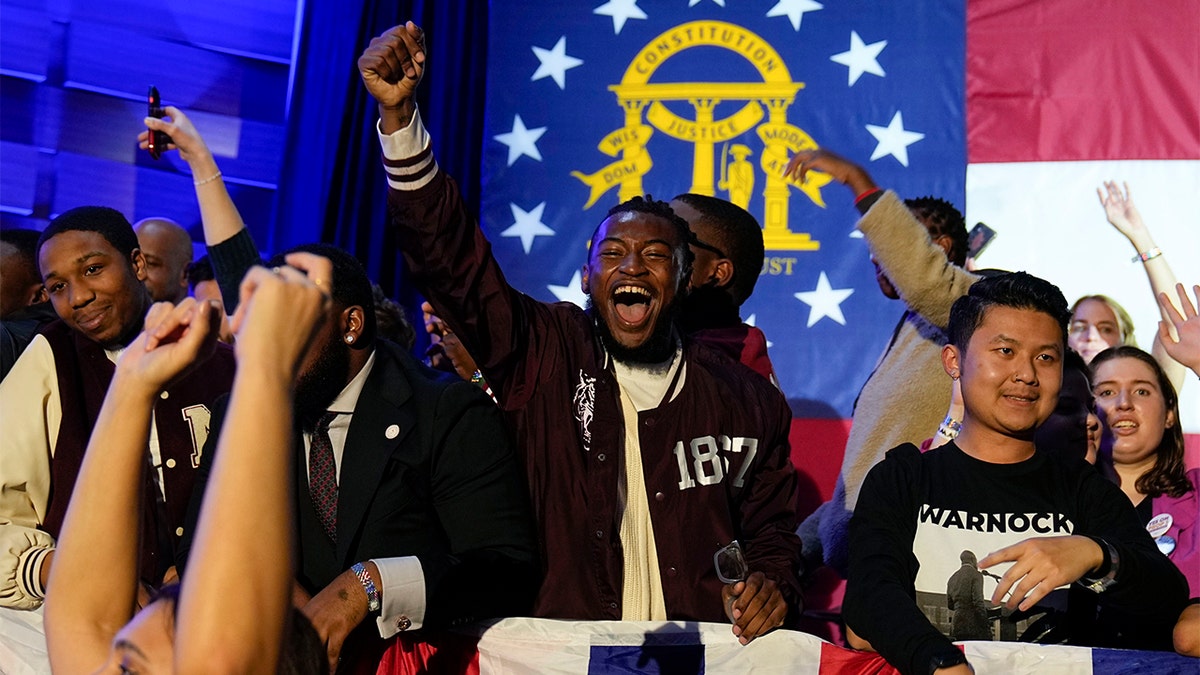 Raphael Warnock supporters cheer on election night