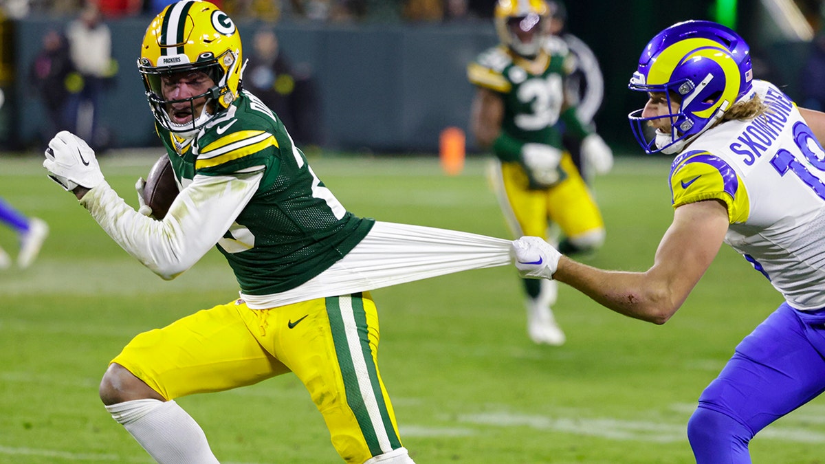 Rasul Douglas avoids Ben Skowronek
