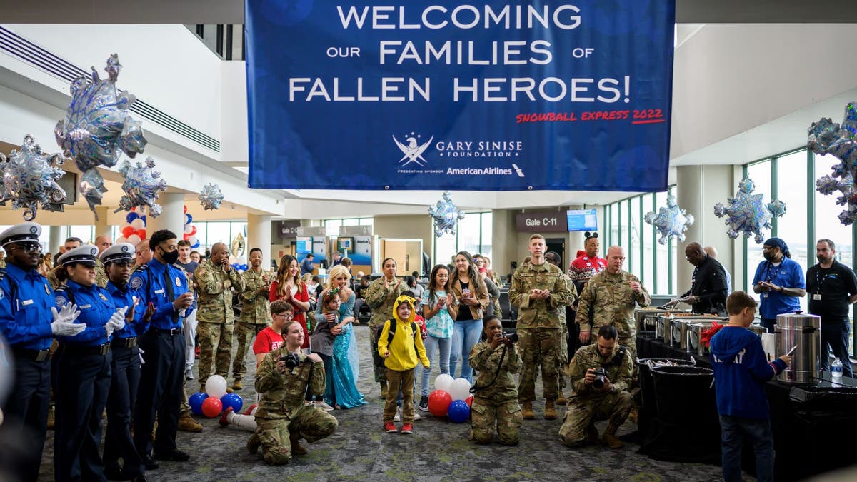 Military welcomes family at airport for Gary Sinise Foundation event