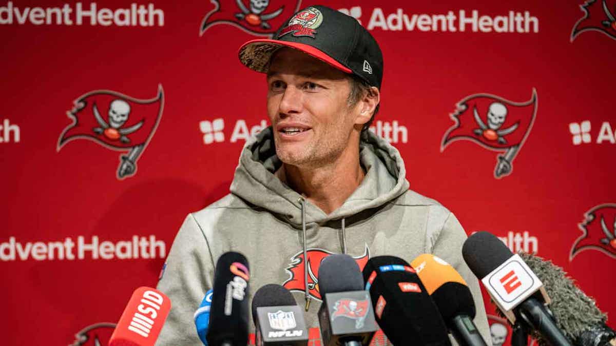 Tom Brady at a press conference in Germany