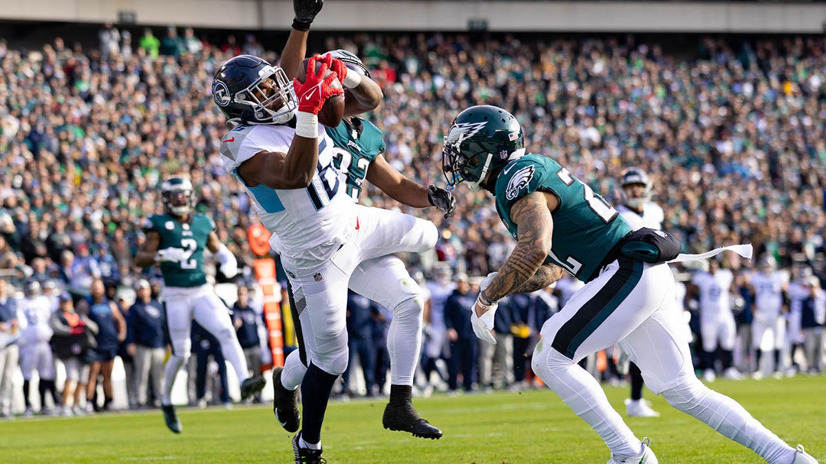 Titans' Treylon Burks takes brutal hit to facemask, somehow maintains  touchdown catch