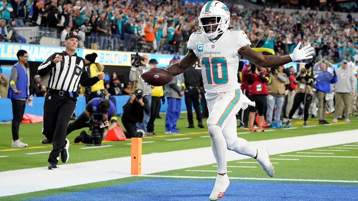 Miami Dolphins Receiver Tyreek Hill Dunks in Puma Sneakers