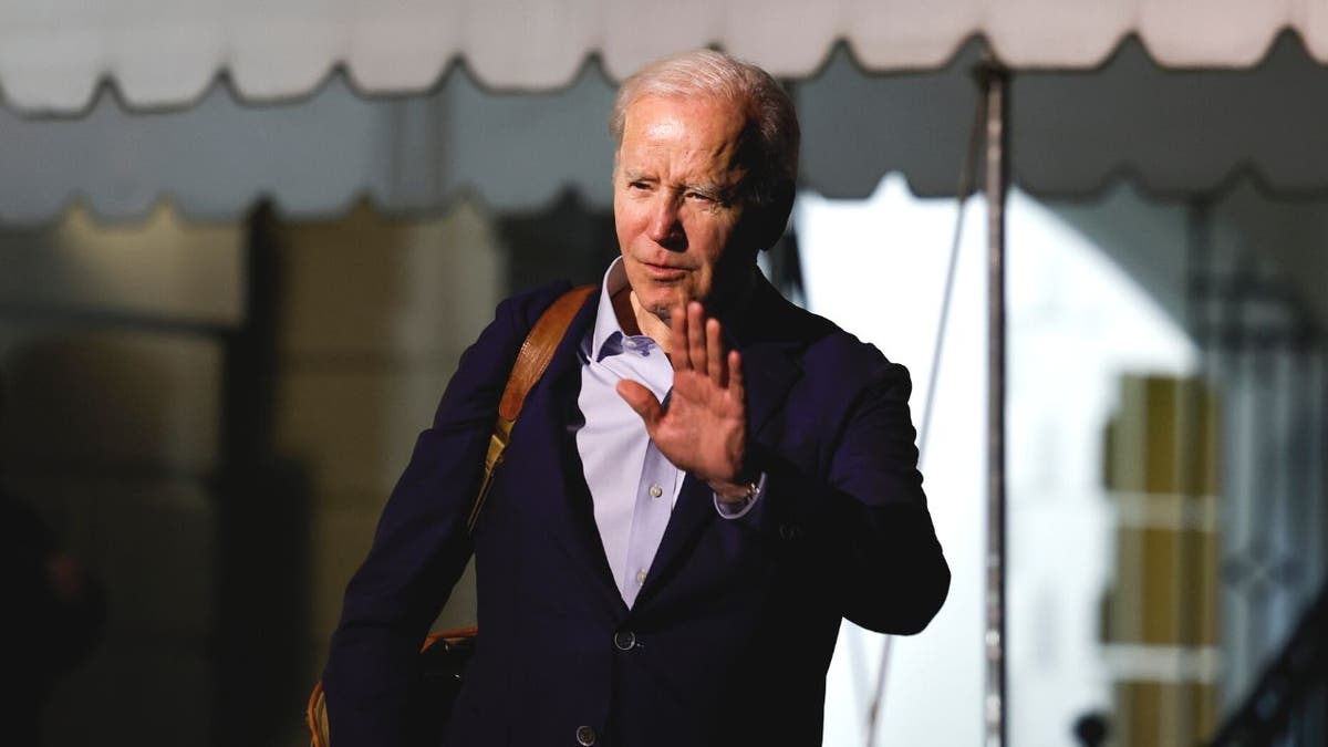 Biden waving outside White House