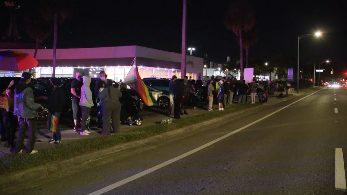 Protesters and supporters demonstrate outside of a Christmas drag show event in Orlando, Florida